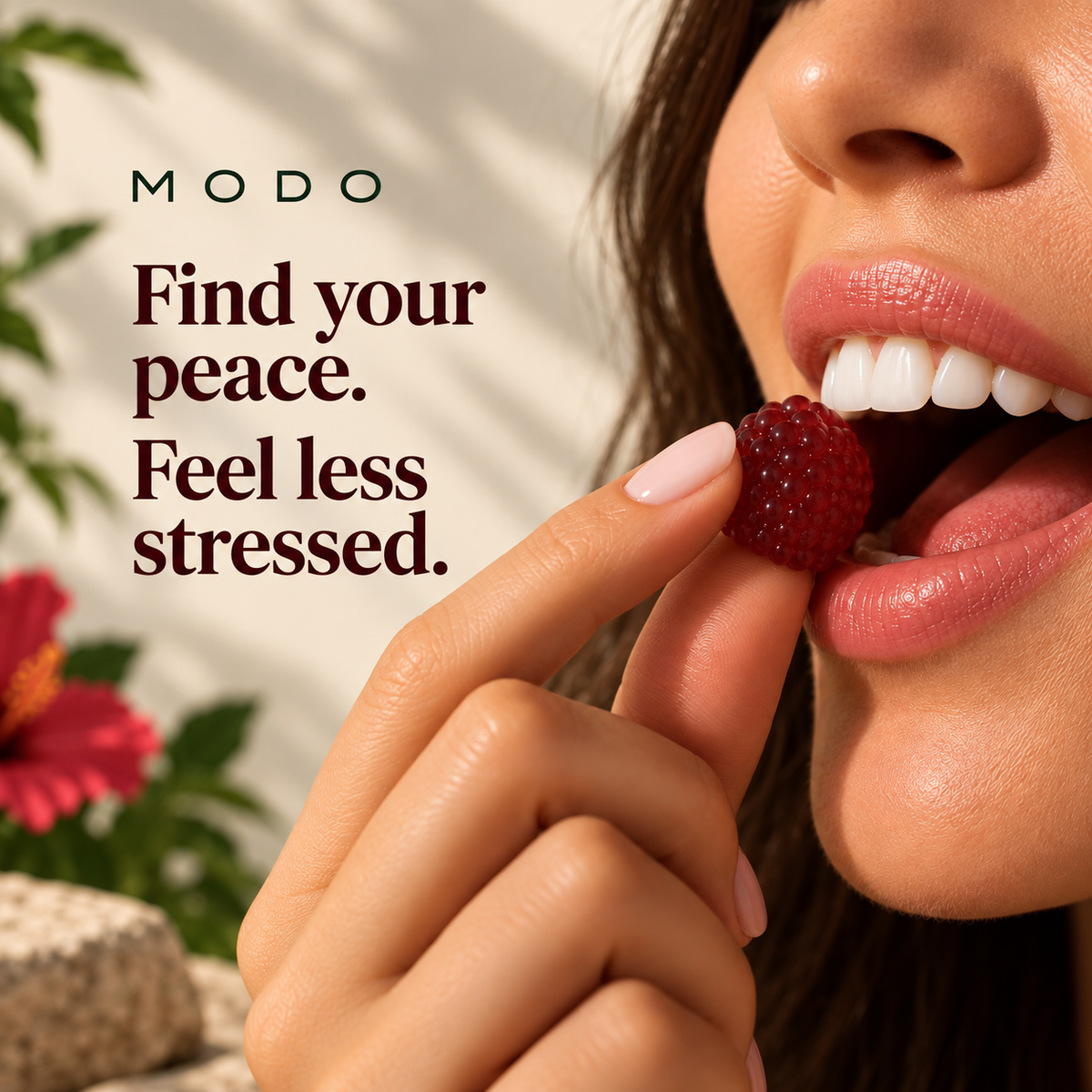 A MODO Calm strawberry hibiscus gummy being eaten