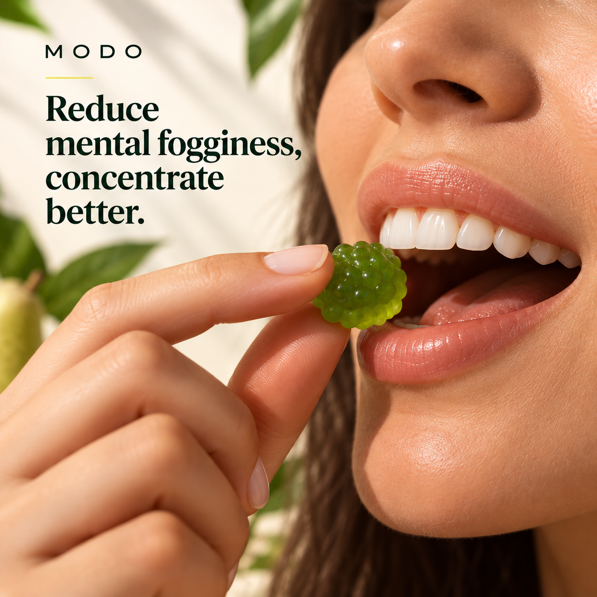 A MODO Focus pear gummy being eaten